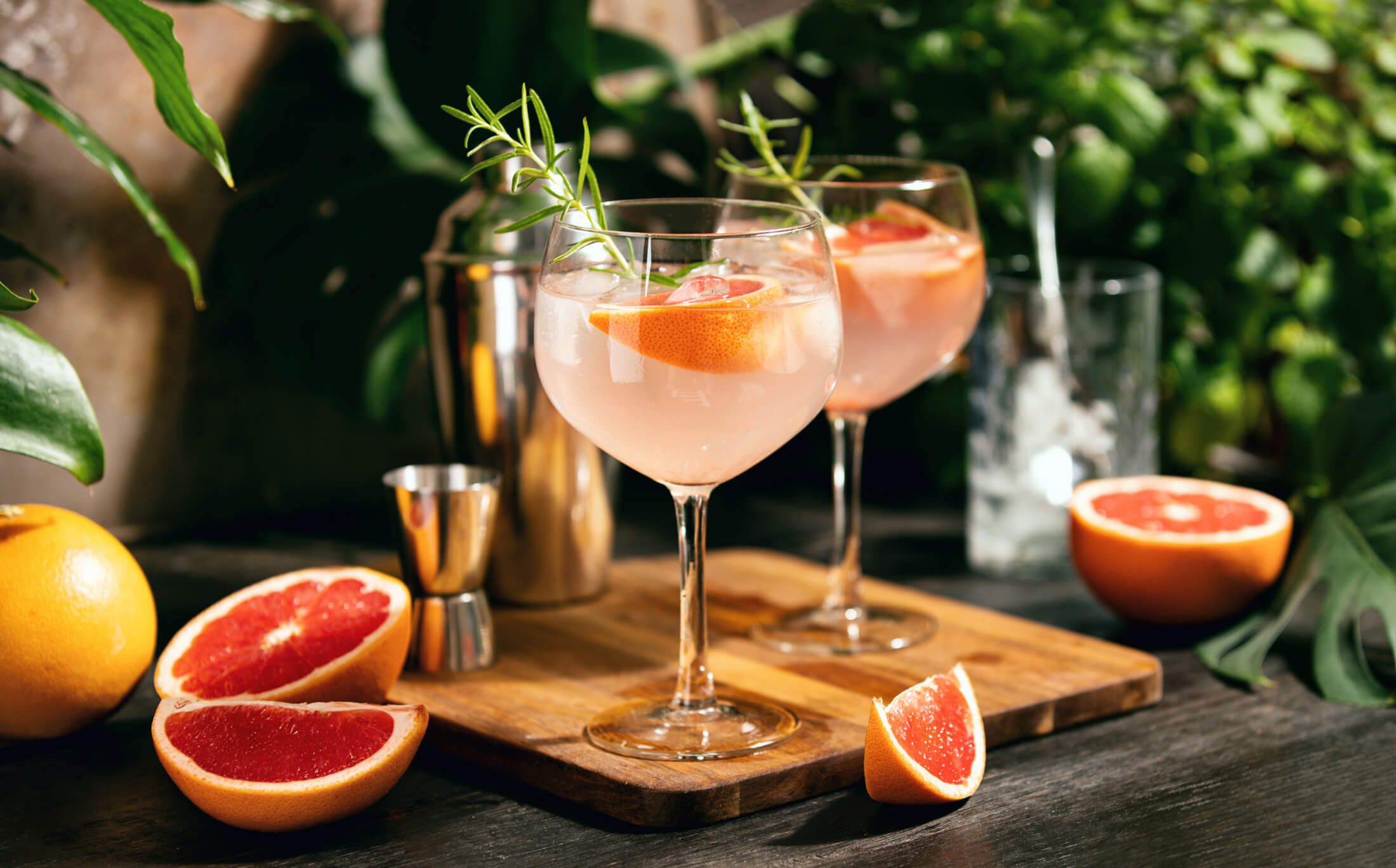 Two colorful cocktails make with red grapefruit
