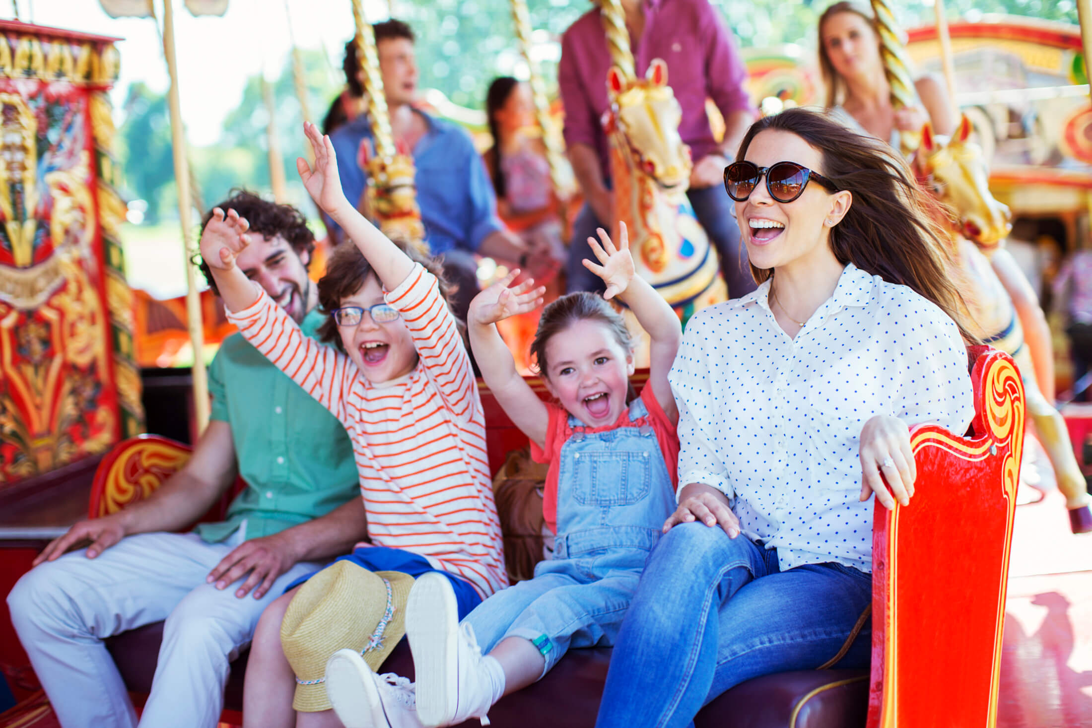 a family ridding an amusement park ride
