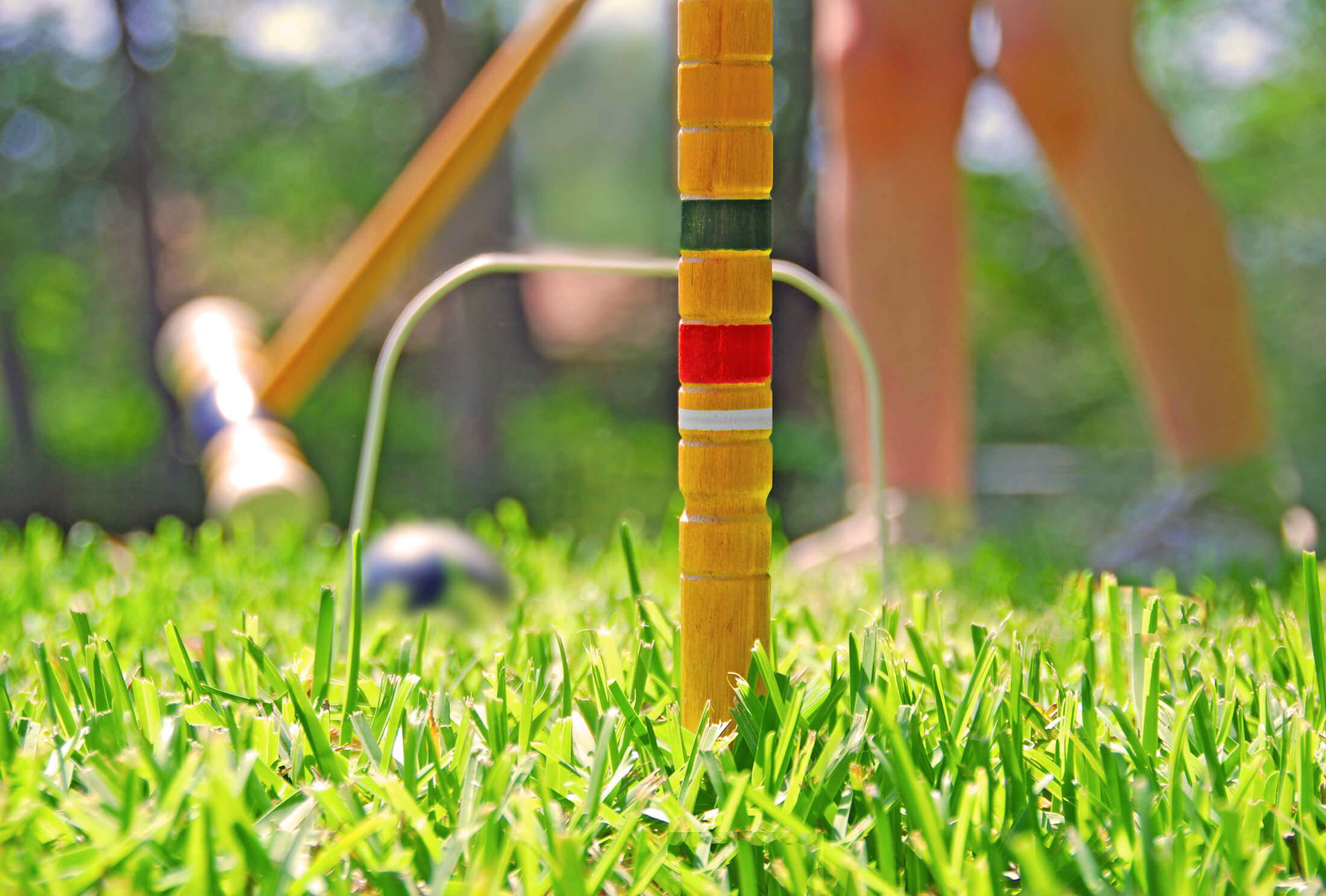 A child playing croquet