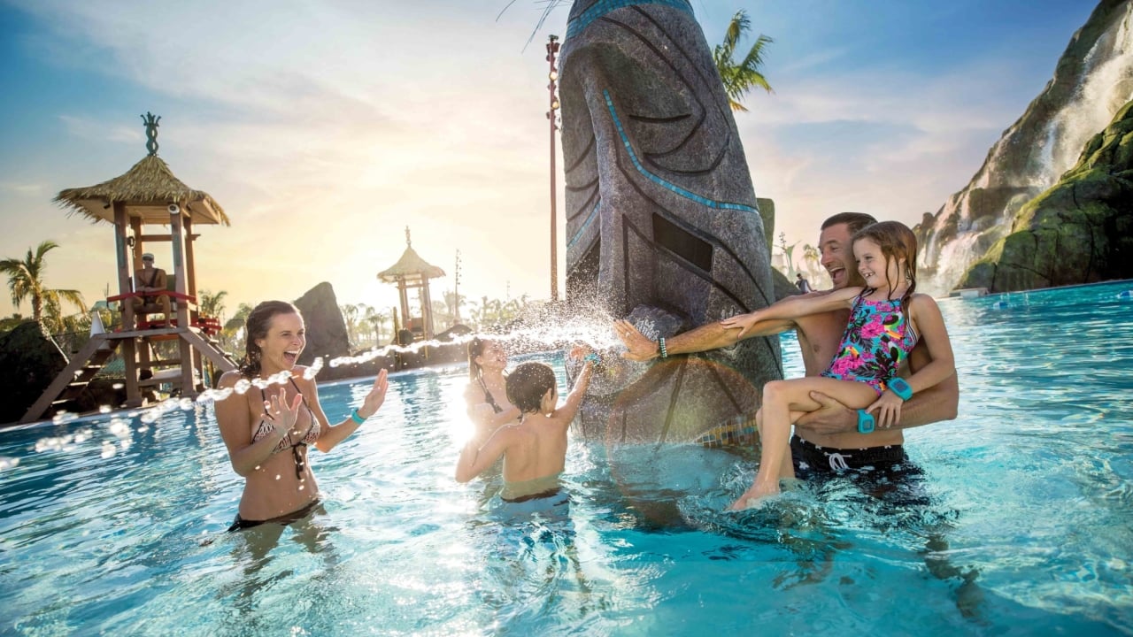 a family playing in a waterpark