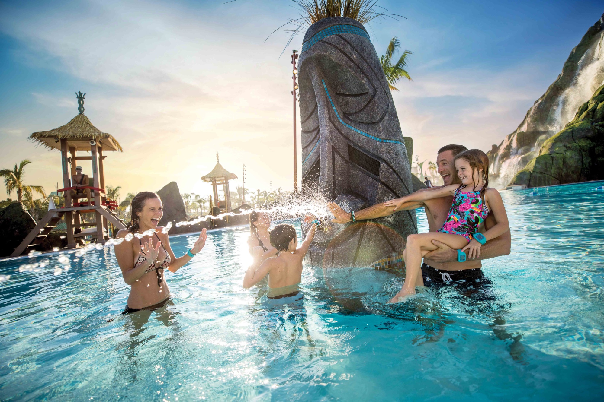 a family playing in a waterpark