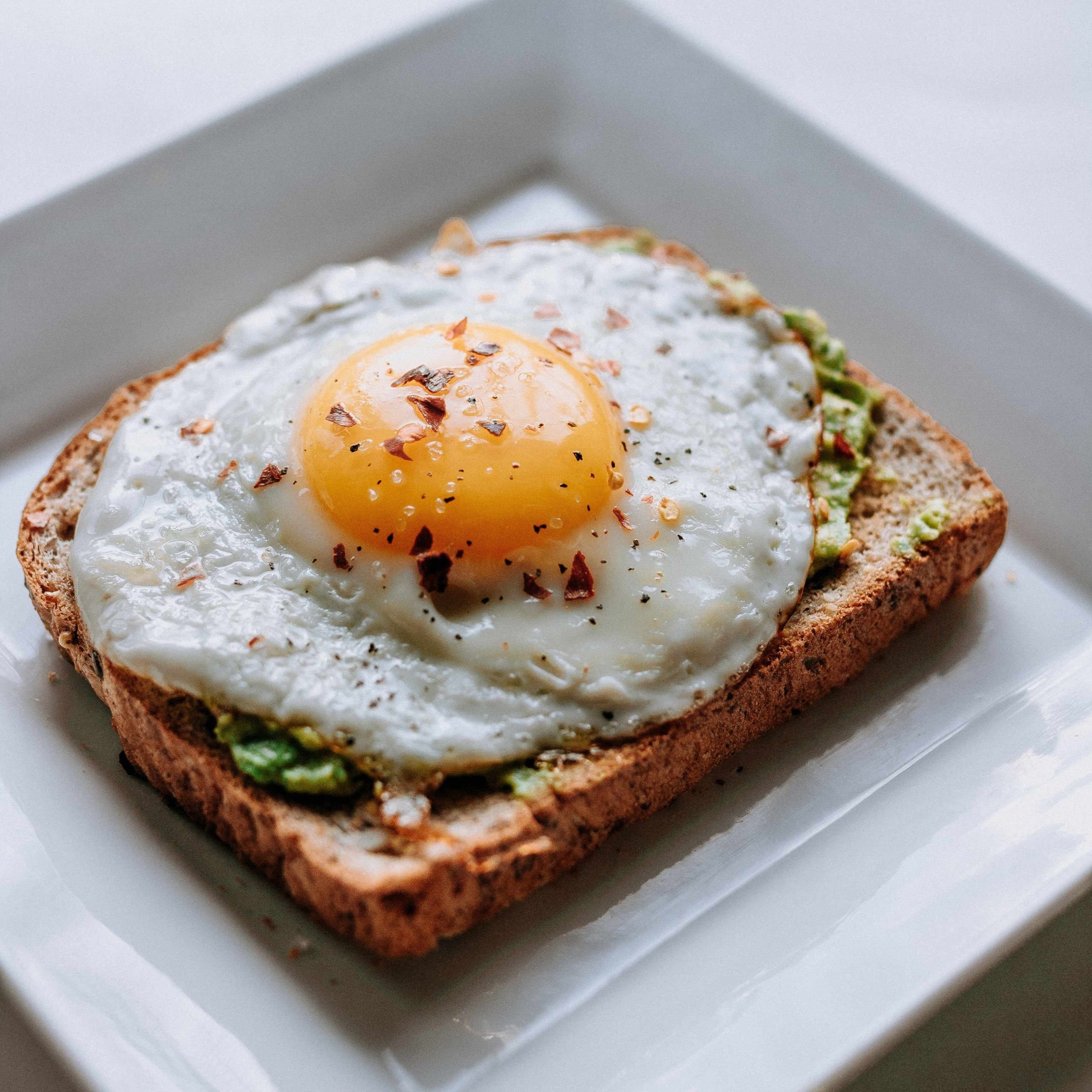 Avocado toast with a fried egg on top