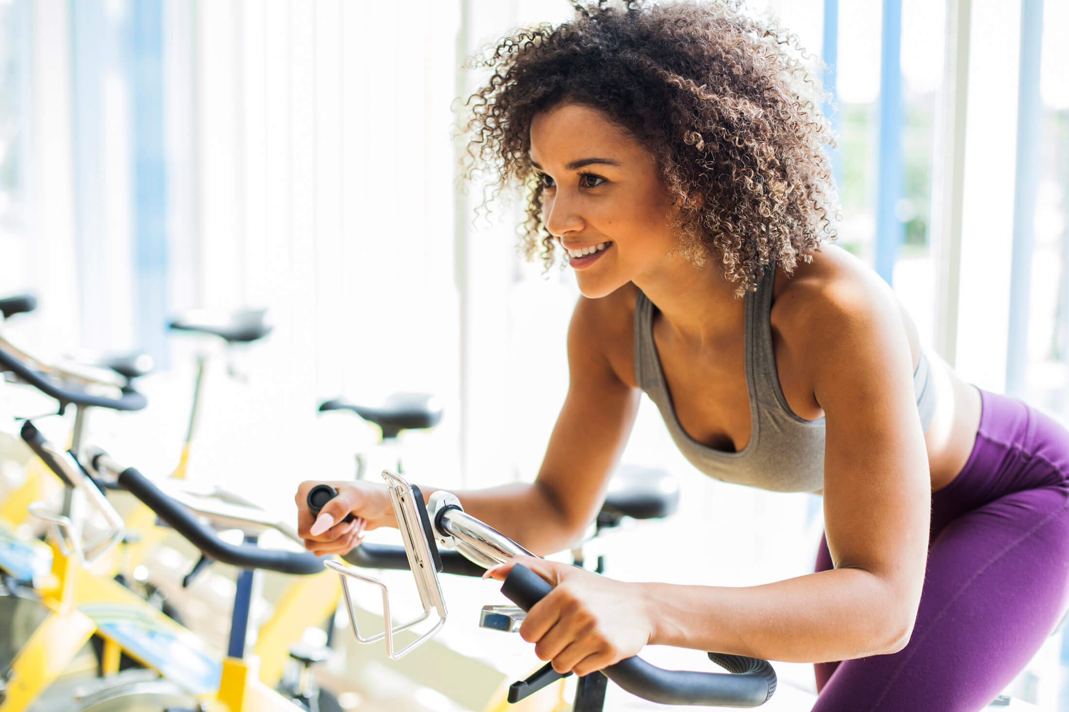 A woman riding an exercise bike
