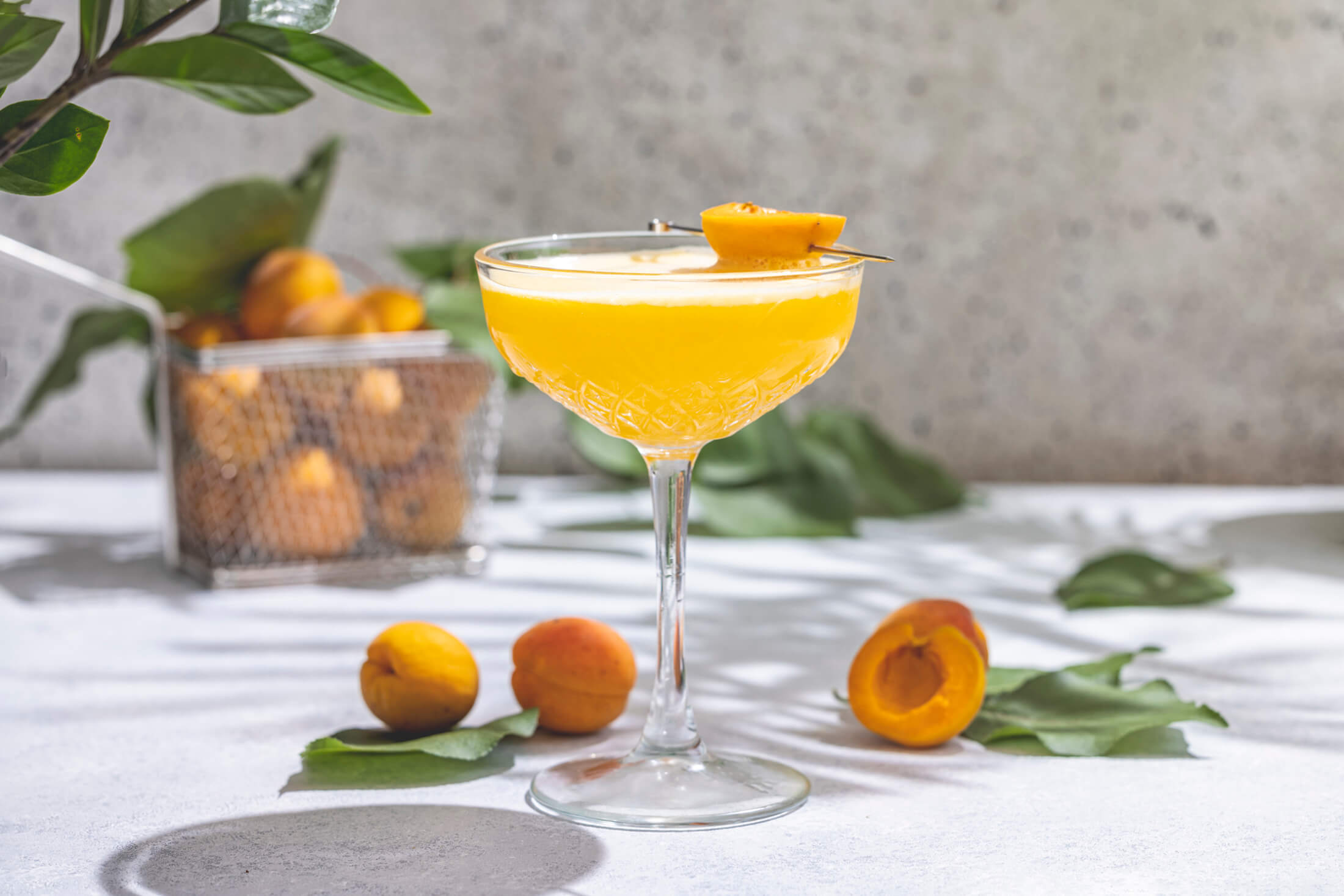 a handcrafted cocktail make with nectarines