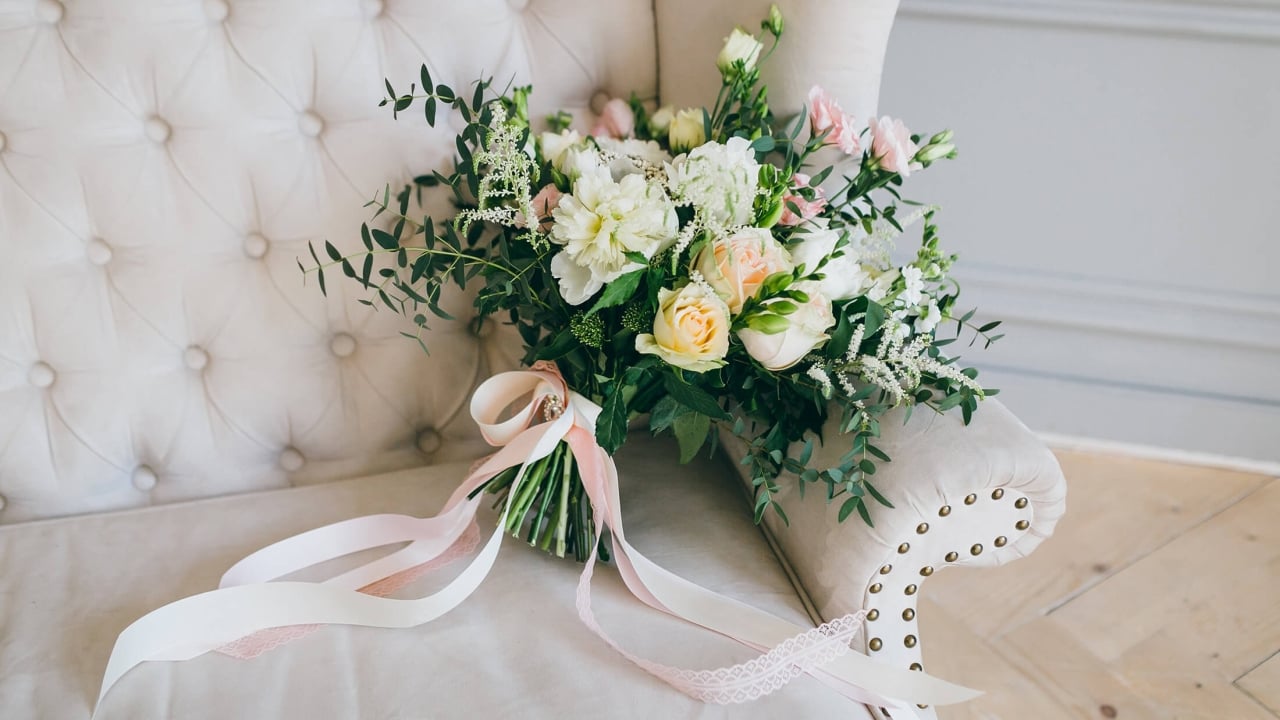 A bridal bouquet on an armchair