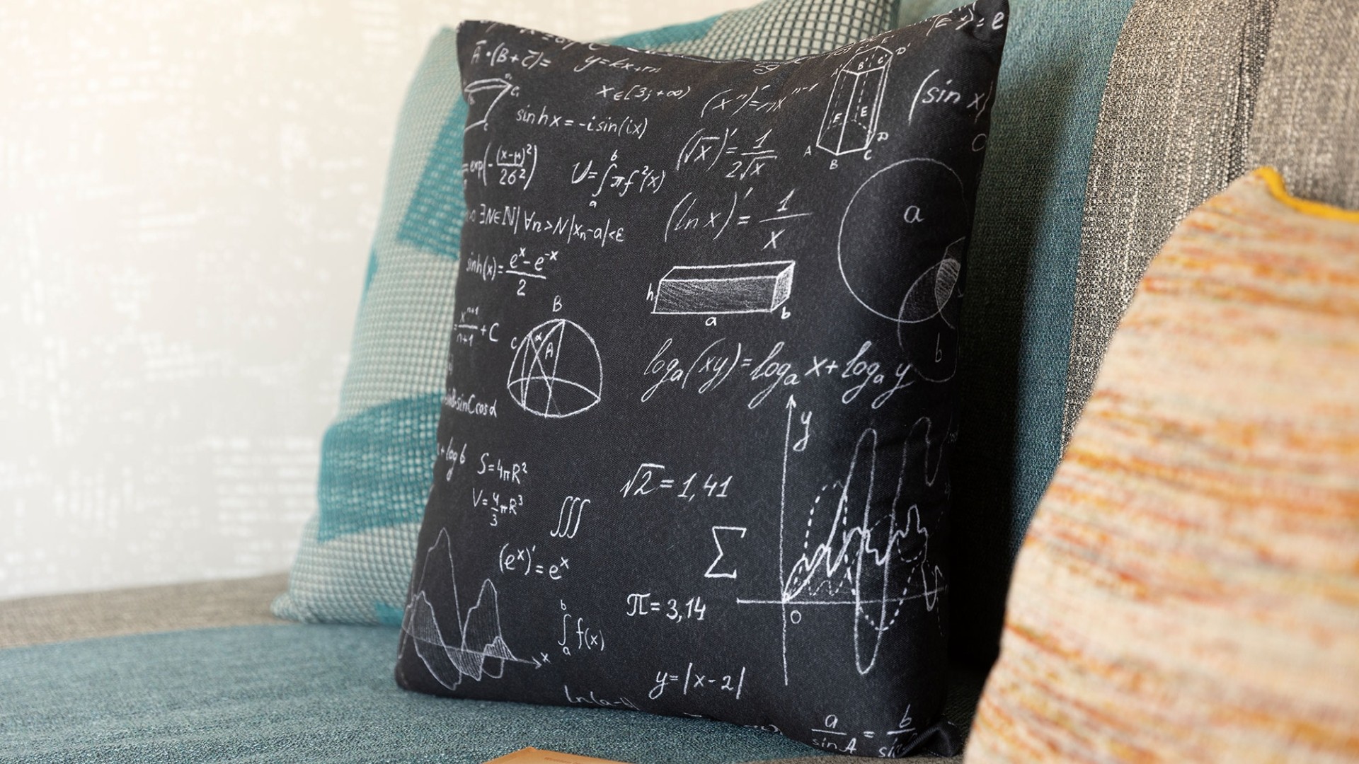 A pillow with mathmatical equations printed on it
