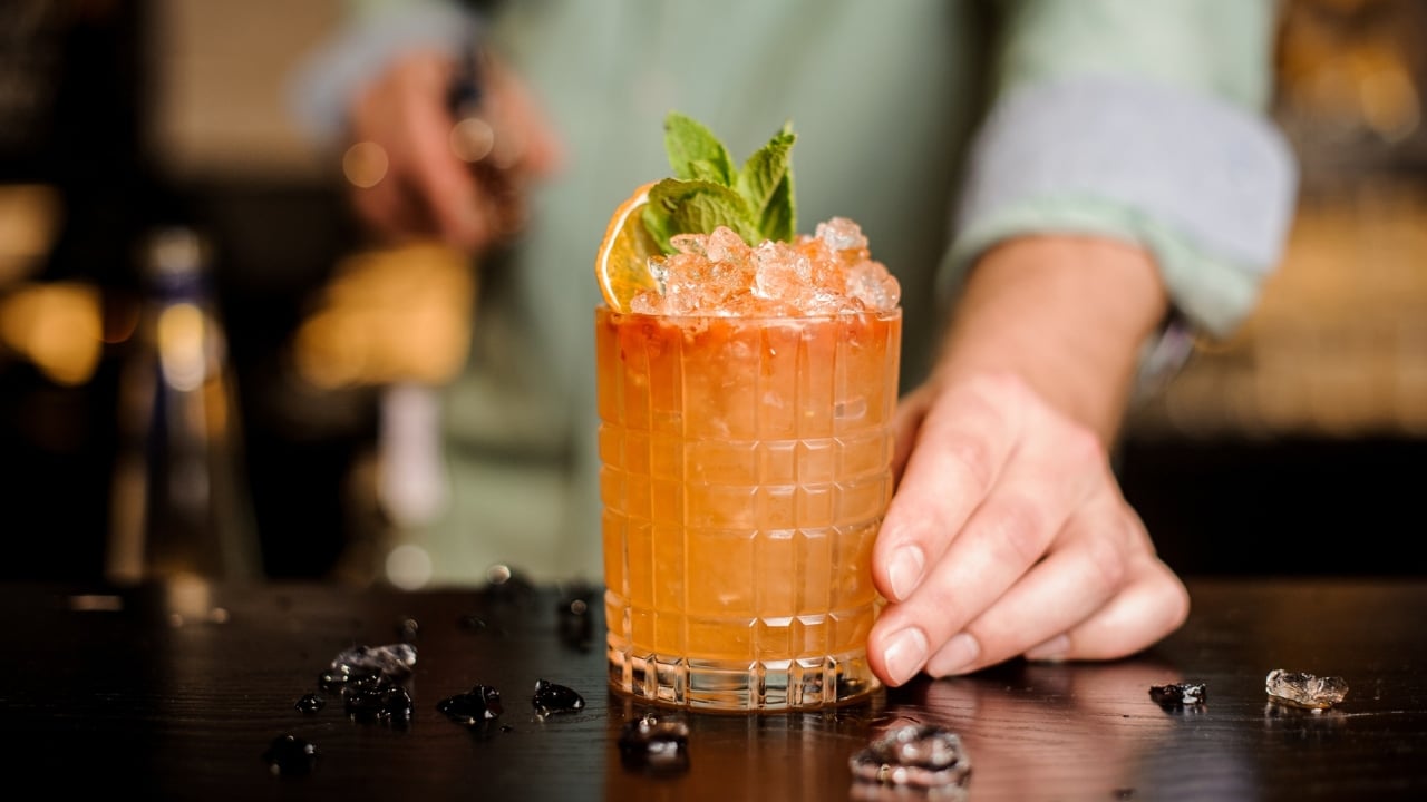 A bartender mixes a refreshing cocktail