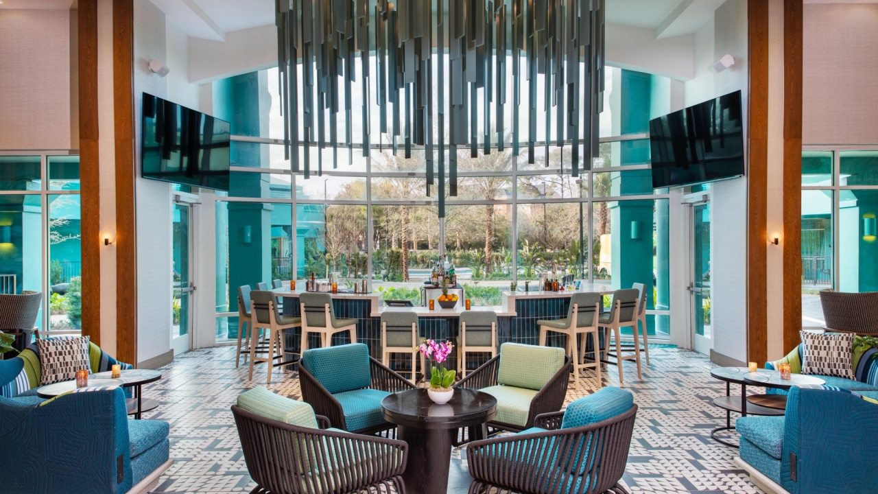 The entryway at Émilie Bar and Lounge. The room has large windows and a beautiful chandelier.