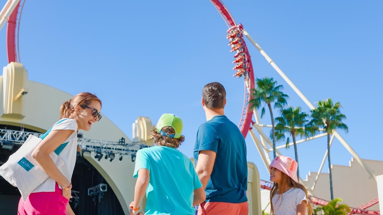Family standing in front of a rollercoaster at Universal Orlando