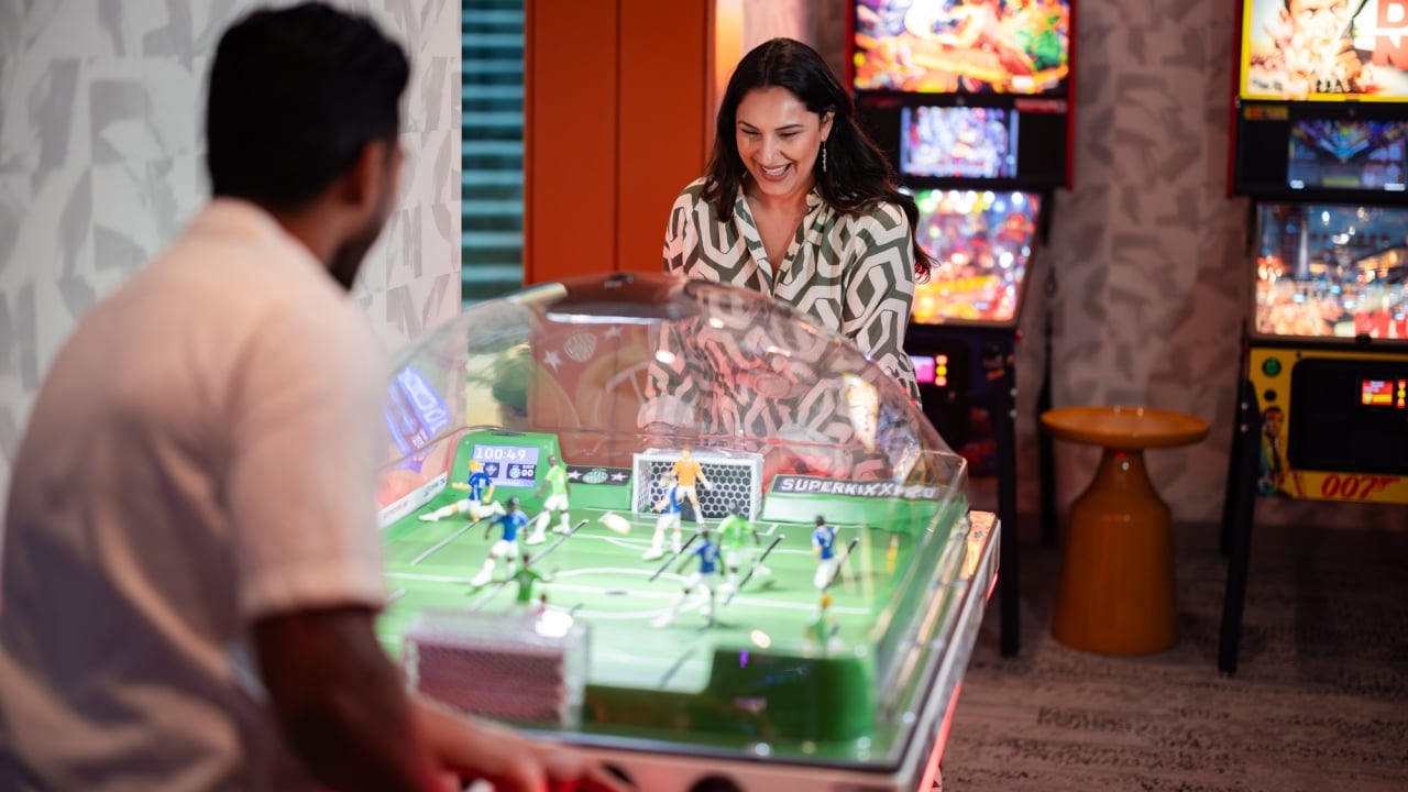 couple playing table soccer