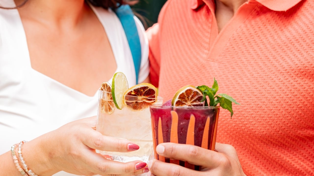 Couple drinking tropical cocktails