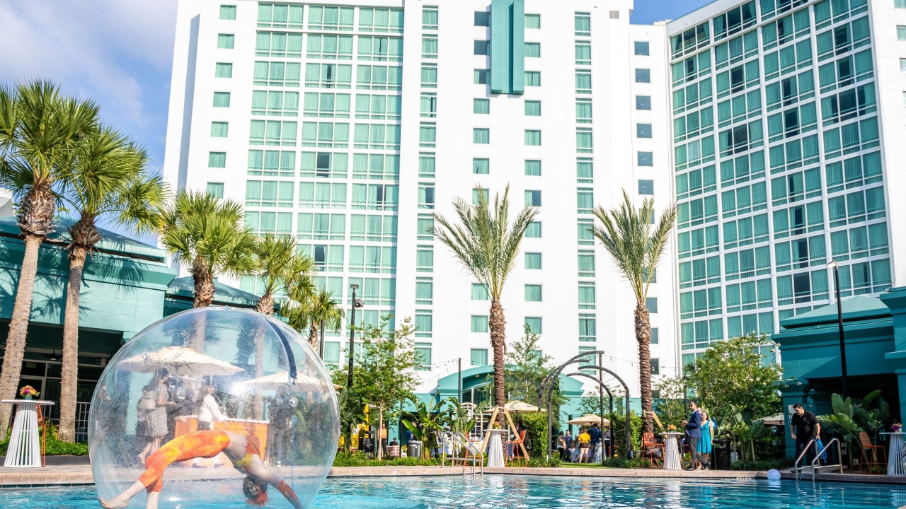 A woman doing gymnastics in a ball on water