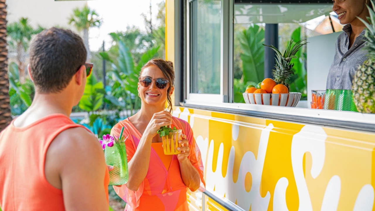 A couple getting drinks at a food truck