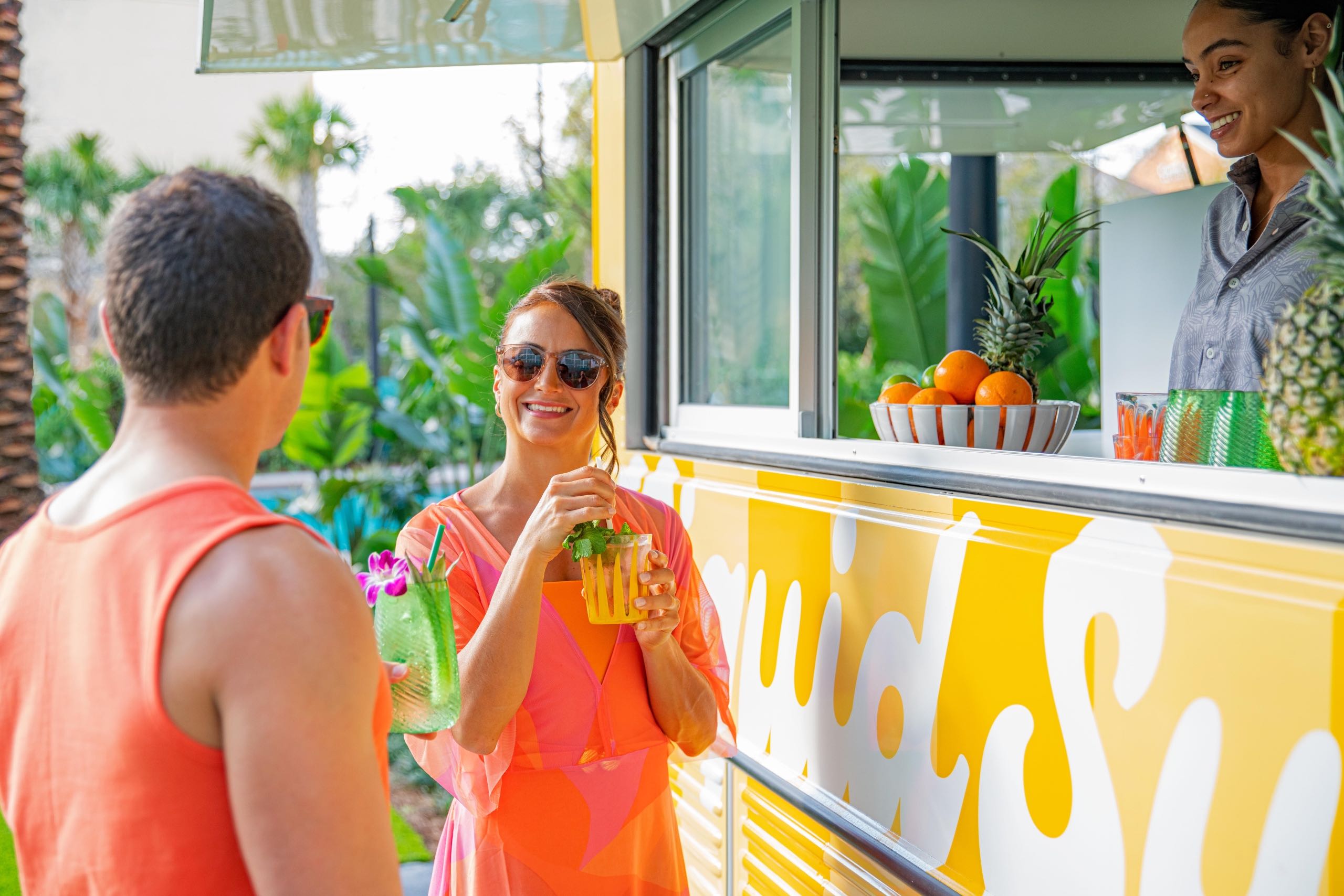 A couple getting drinks at a food truck