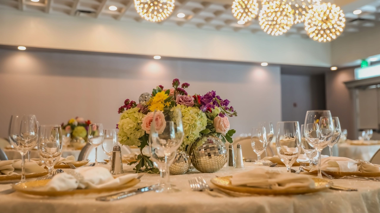 A centerpiece with flowers and discoballs