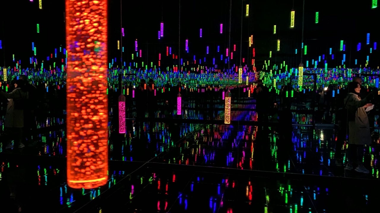 A room full of hanging colourful lights