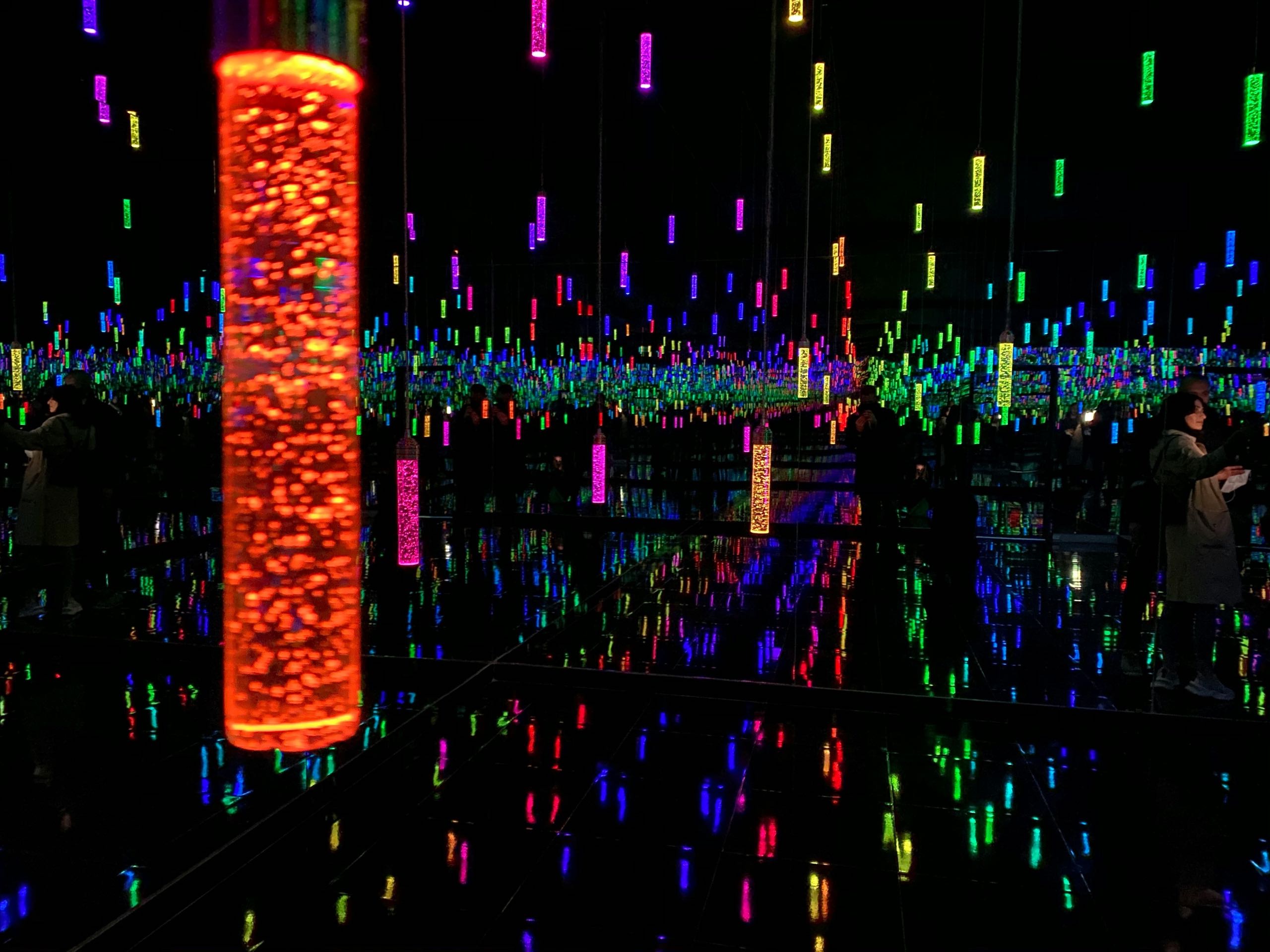 A room full of hanging colourful lights