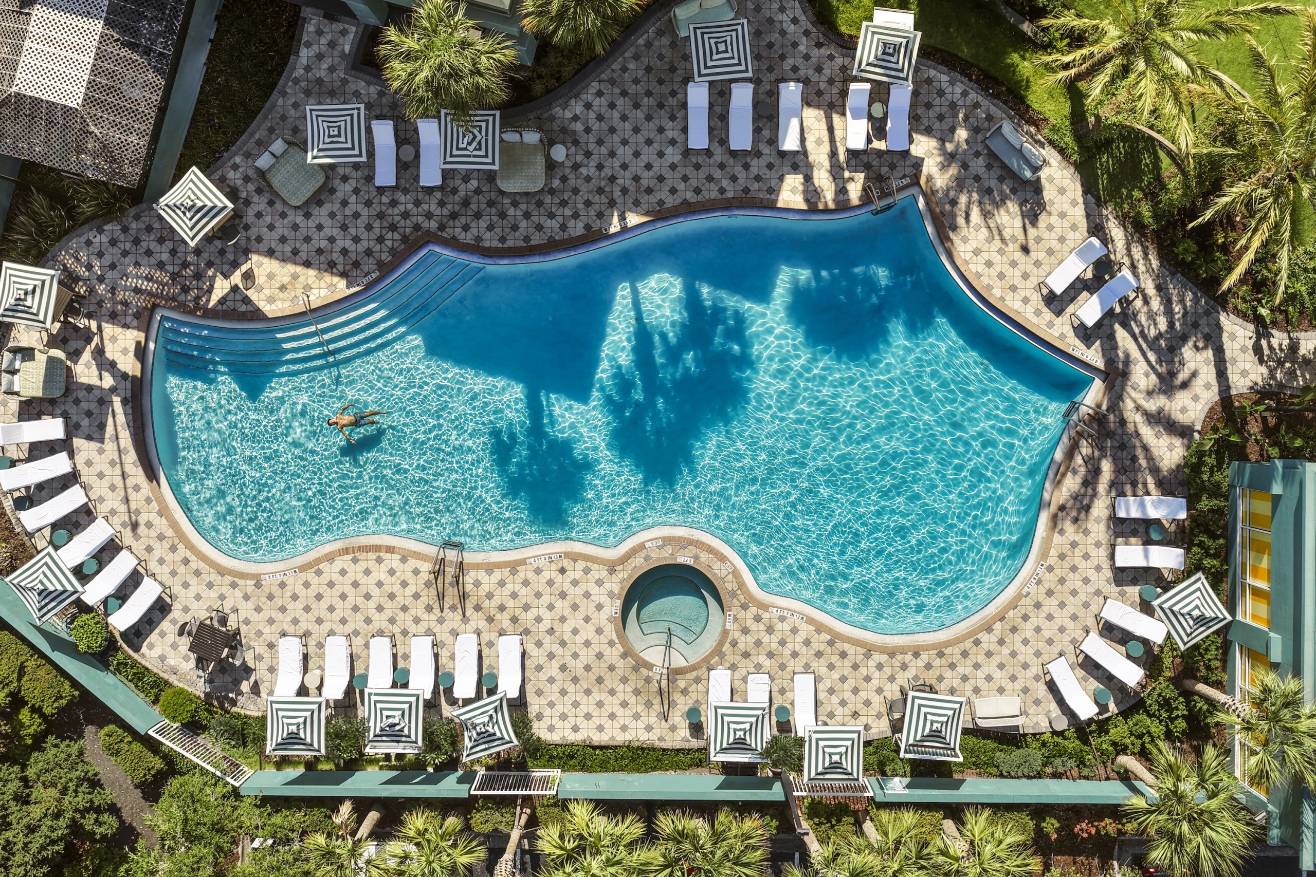 Aerial, top-down-view of the Hotel Landy Pool